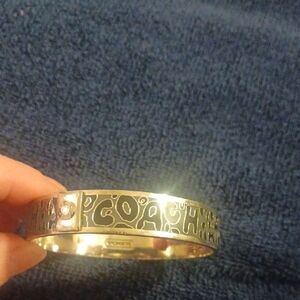 Coach Gold-tone Logo Cutout Bangle with Crystal Accent